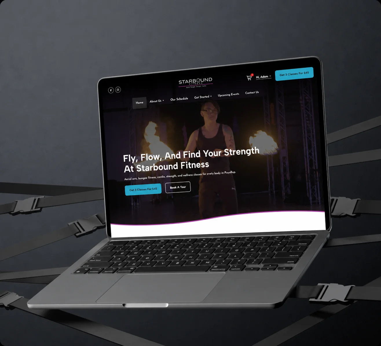 Laptop displaying the Starbound Fitness website home page